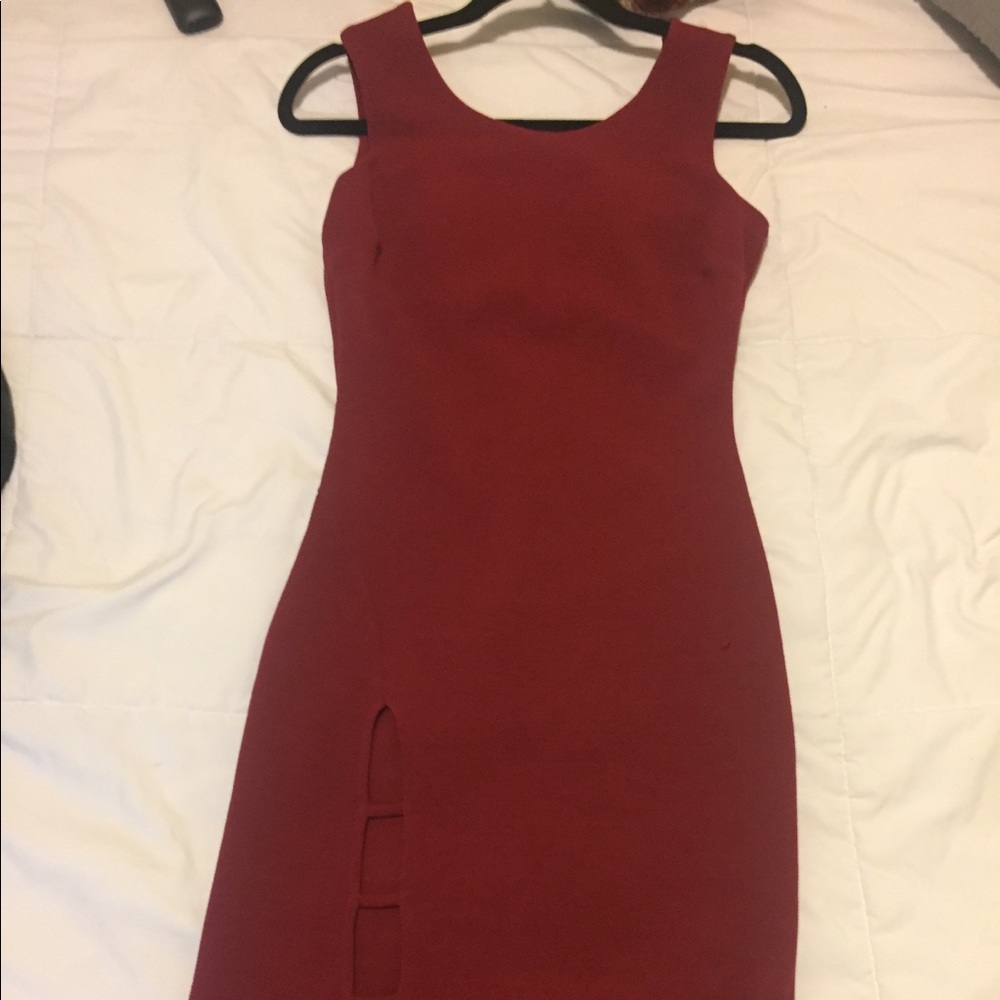 Large dark red dress, sexy leg cut.
